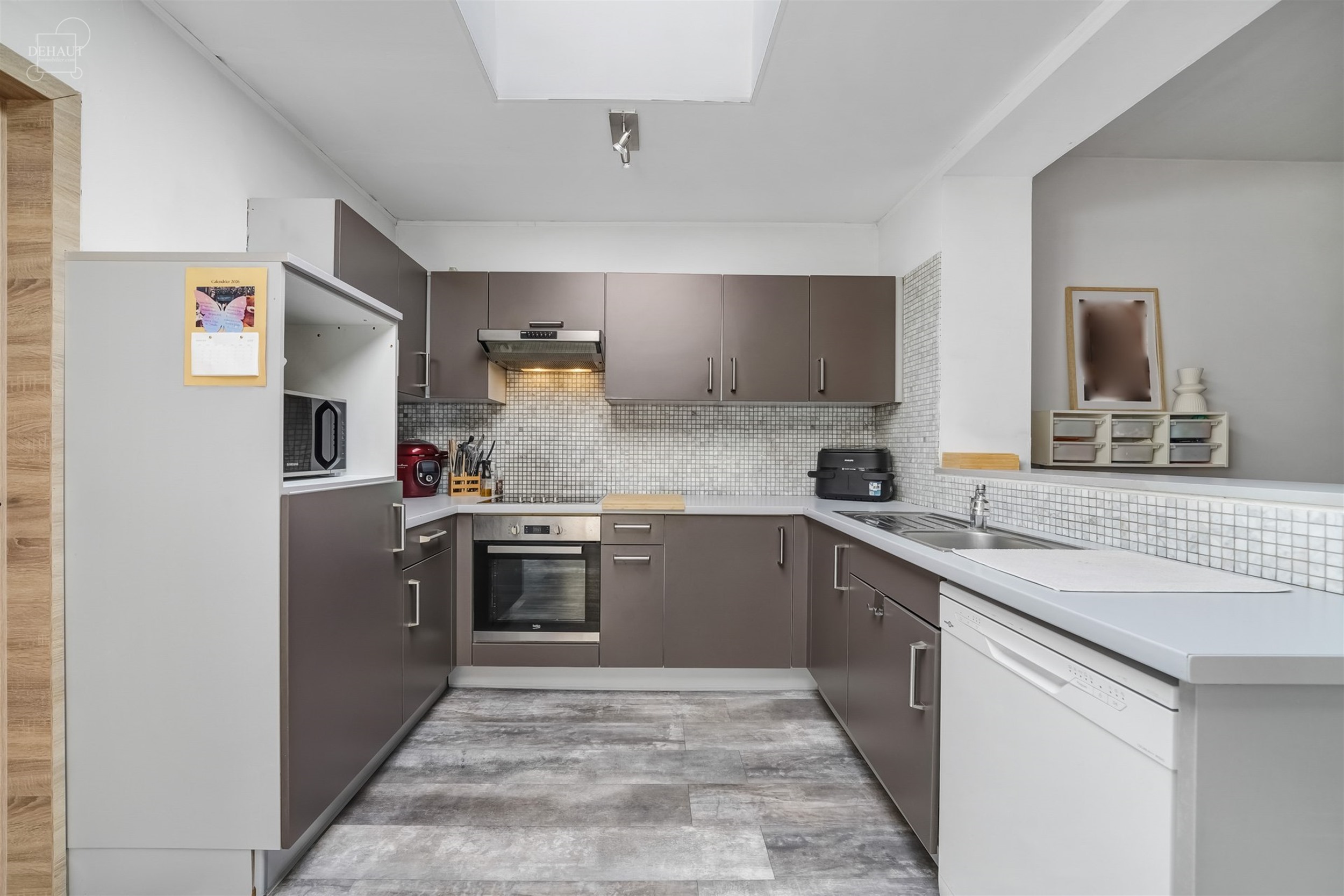 Jolie maison de ville avec garage idéalement située dans une rue calme et prisée. Composée d'un agréable espace de vie avec un insert et un poêl...