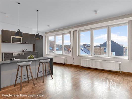 APPARTEMENT LUMINEUX et SPACIEUX de ± 130 m² composé de 2 grandes chambres - Vaste séjour avec cuisine USA équipée - Sanitaires avec chaufferie - Terrasse - Cave - Actuellement aménagé en espace de bureaux - Salle de bain à installer