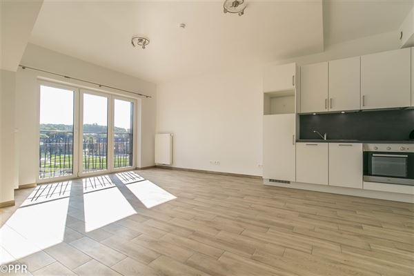 APPARTEMENT NEUF 1 Chambre ± 56 m² - Lumineux avec vue sur Parc - Parking sécurisé - Proche du centre-ville - Séjour avec Cuisine USA