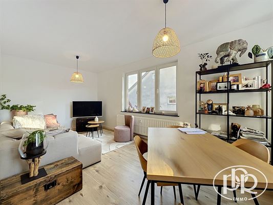 Appartement 2 chambres de ± 85 m² avec balcon 2 m² orienté Est, idéalement situé dans le centre