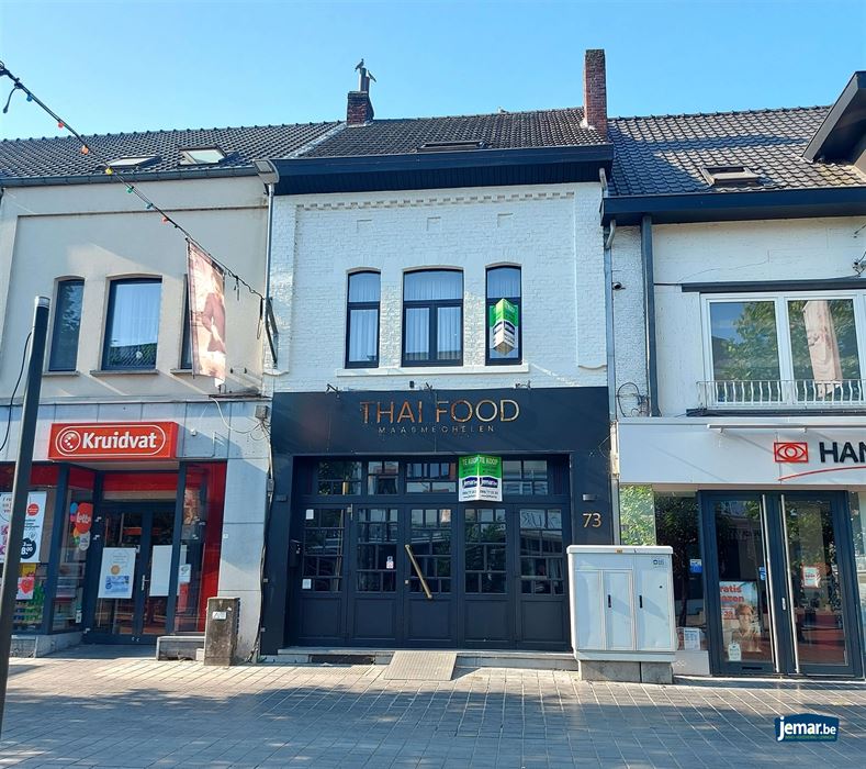 Handelspand met woonst en achteringang op de Pauwengraaf