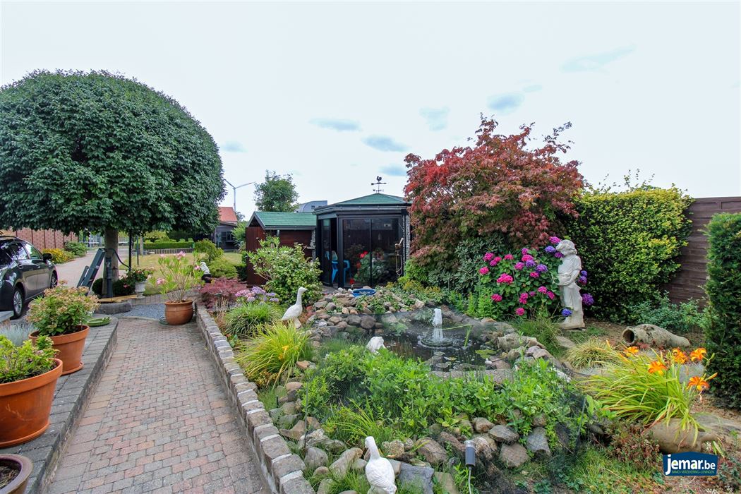 Instapklare en perfect onderhouden woning met 3 slaapkamers, 2 badkamers en een prachtige tuin van 6a74ca in hartje Maasmechelen!