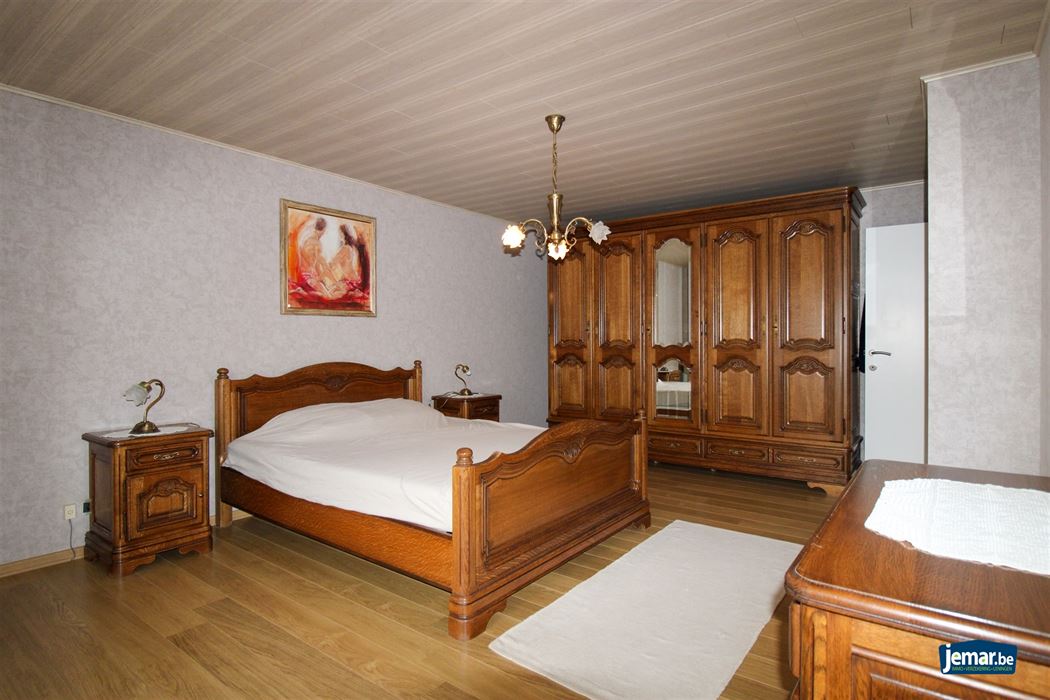 Instapklare en perfect onderhouden woning met 3 slaapkamers, 2 badkamers en een prachtige tuin van 6a74ca in hartje Maasmechelen!