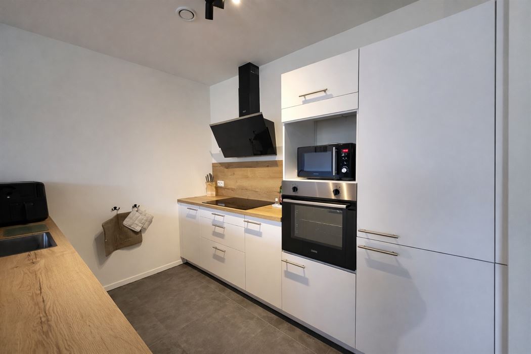 Prachtig luxueus appartement met terras, ondergrondse garage en hoogwaardige technieken op topligging nabij het centrum van Genk