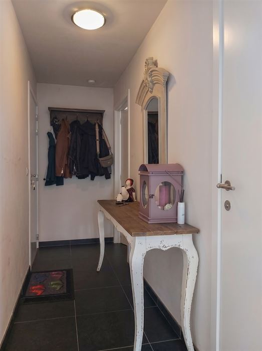 Instapklaar duplexappartement met inpandige garage, zuidgericht terras en 2 slaapkamers op mooie locatie in Maasmechelen!