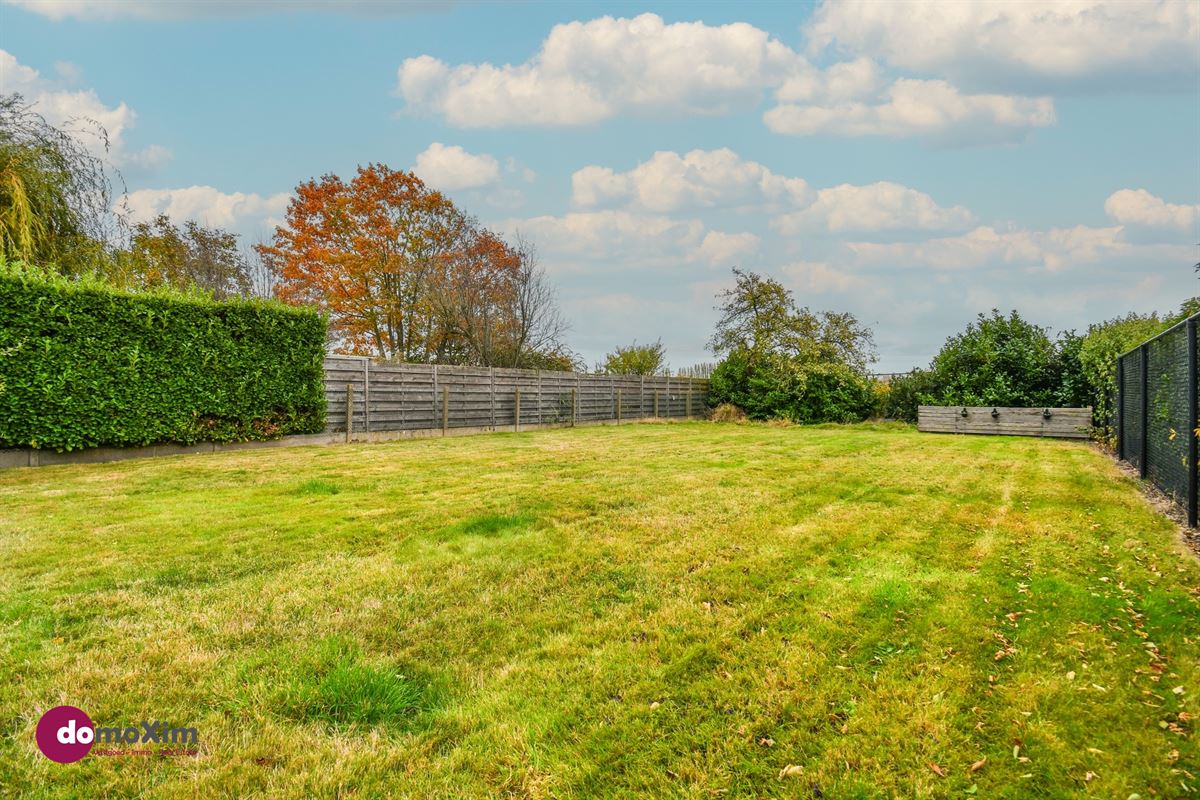 Maison à fort potentiel et magnifique jardin avec vue sur la verdure à Boortmeerbeek