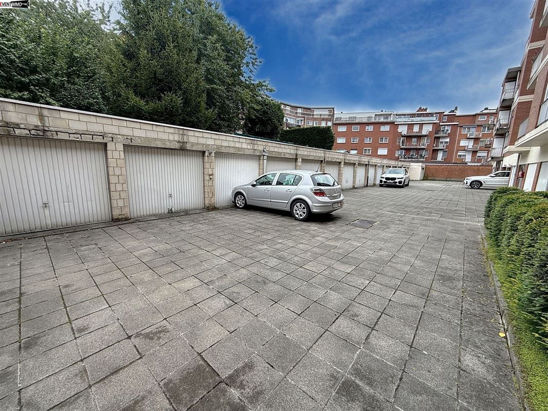 Closed garage/box located at the rear of the building