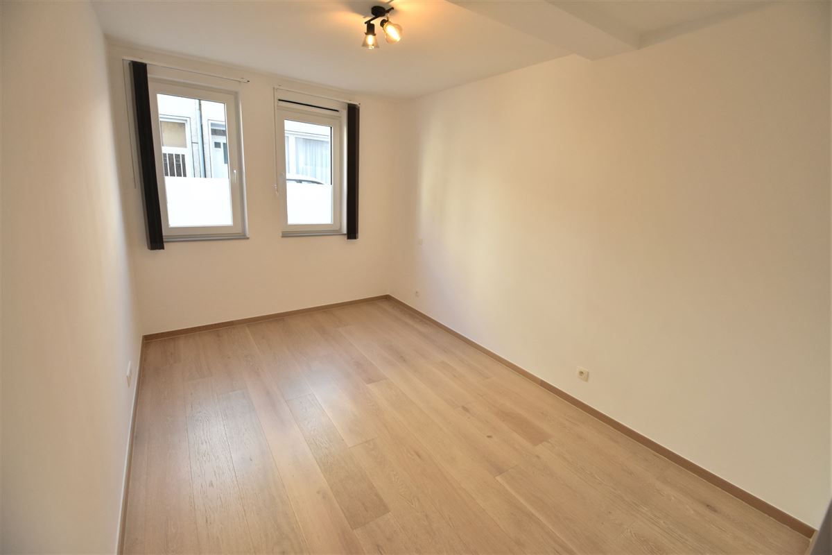 Appartement 2ch. + 2 parkings en plein centre !